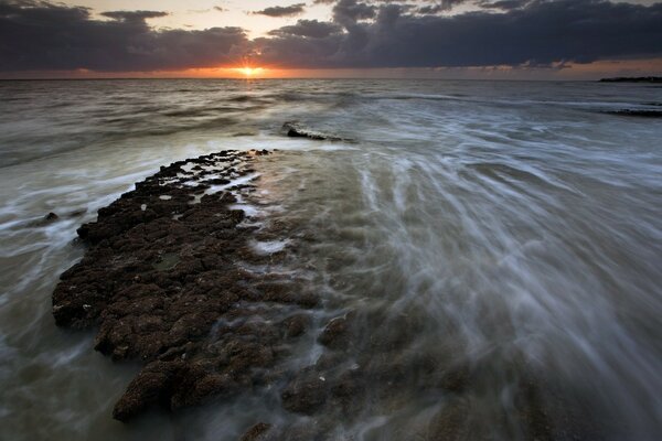 Raging ocean and cloudy sky 