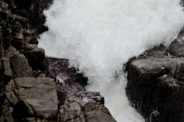 A powerful waterfall in the very center of the landscape