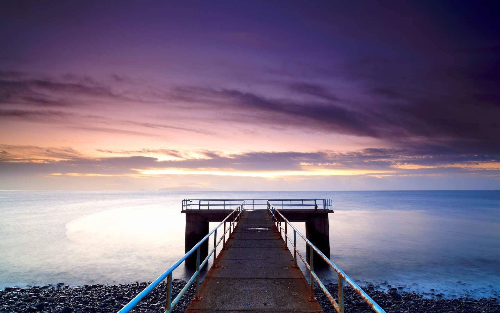 sea and ocean sunset water sea beach dusk ocean pier jetty sky dawn travel sun evening landscape seascape bridge seashore light