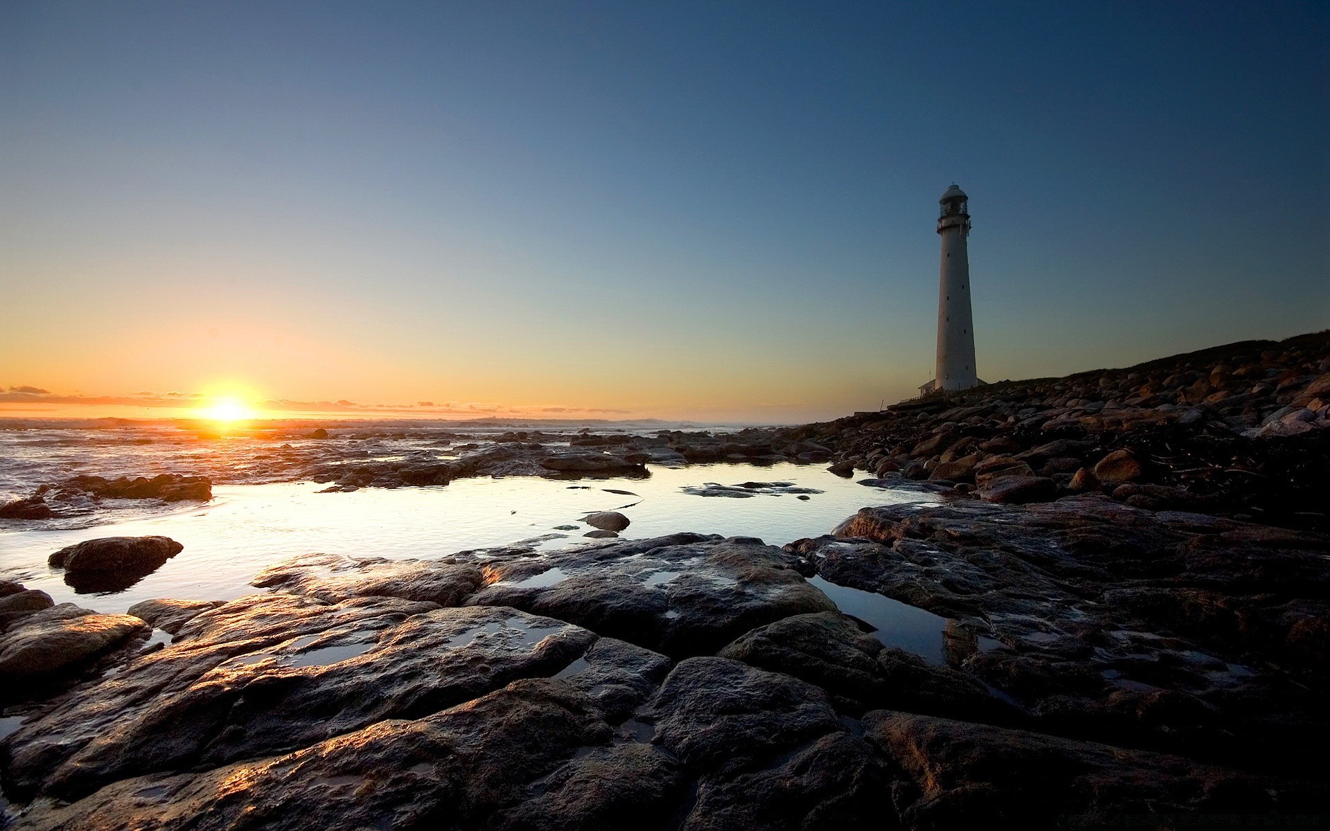 sea and ocean sunset water lighthouse sea ocean beach seashore dawn dusk seascape sky evening sun light landscape nature travel rock outdoors