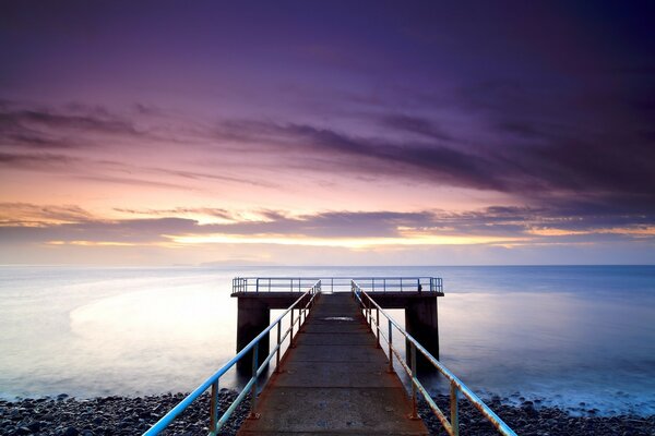 The road to heaven. Sunset on the background of water