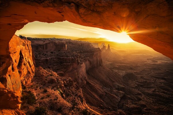 The sun shines in the rock grotto