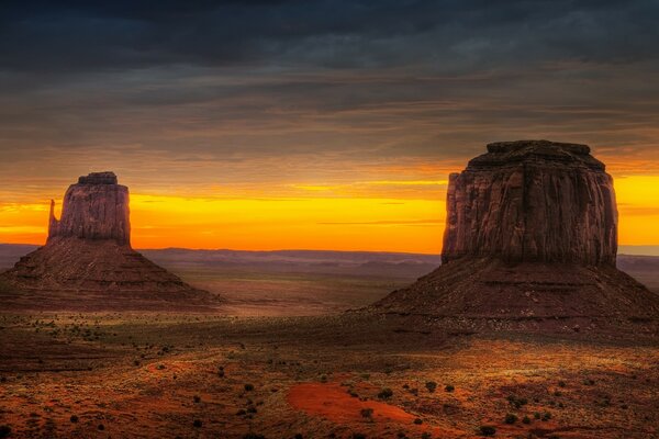 Sunset in the desert and the rocks of the mountains