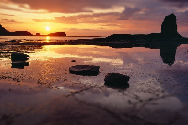 Fiery dawn over the sea beach