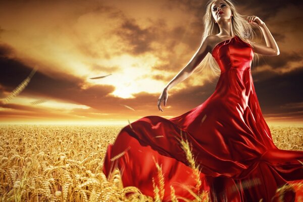 गेहूं के खेत में लाल पोशाक में एक लड़की