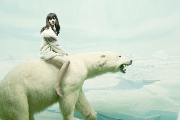 A girl is sitting on a polar bear