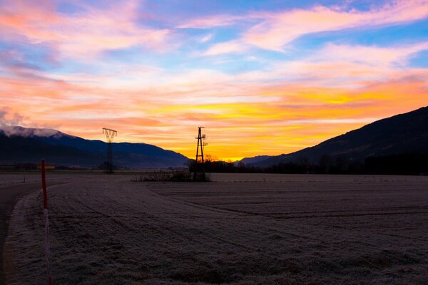 A plowed field at sunset