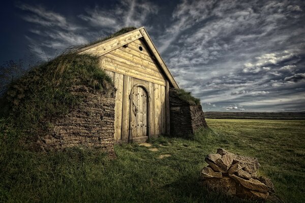 An old wooden building against a dark sky