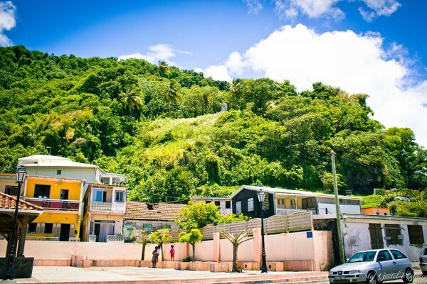 A city on the slope of a green mountain