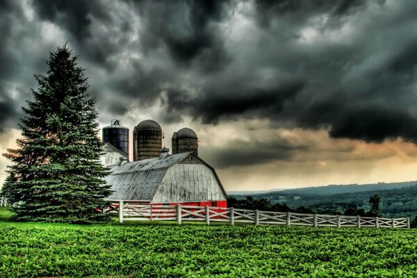 Thunderclouds over grain storage in rural areas