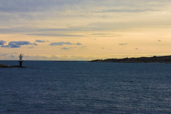 Lighthouse on a spur in a quiet bay