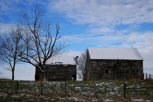 Landscape with an abandoned house at the beginning of winter