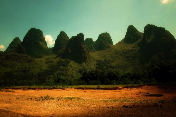 Green mountains and yellow fields