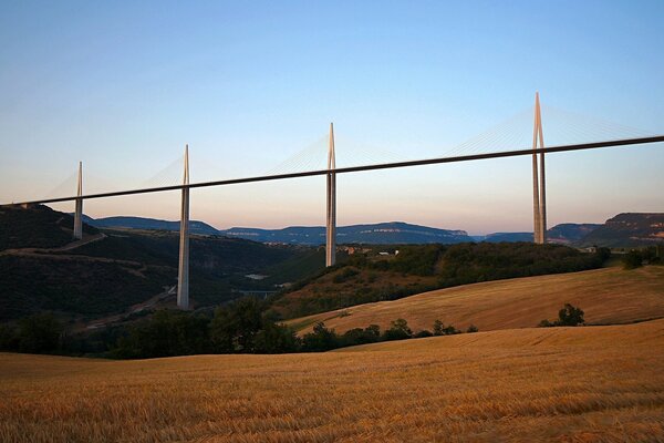 Cable-stayed bridge over a mountainous plain