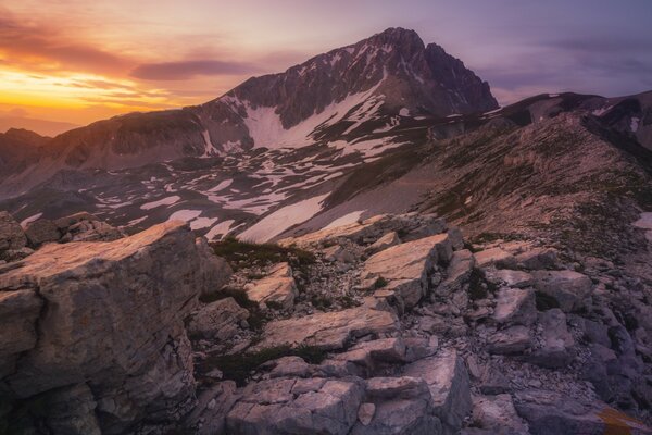 Harsh rocky mountains at sunset