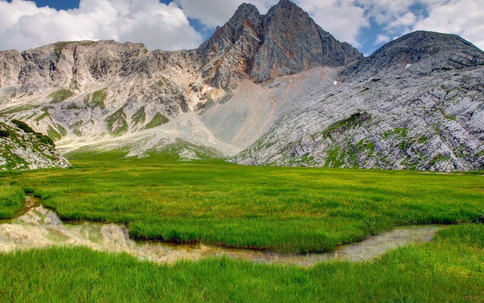 mountains landscape mountain nature travel outdoors sky scenic grass valley summer mountain peak rock water snow hill hayfield