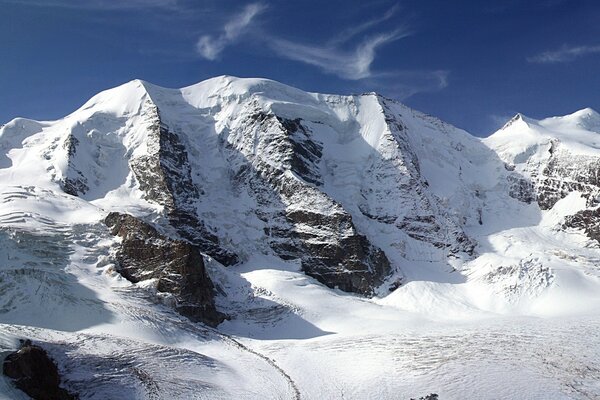 Snow-covered mountain ranges against the sky