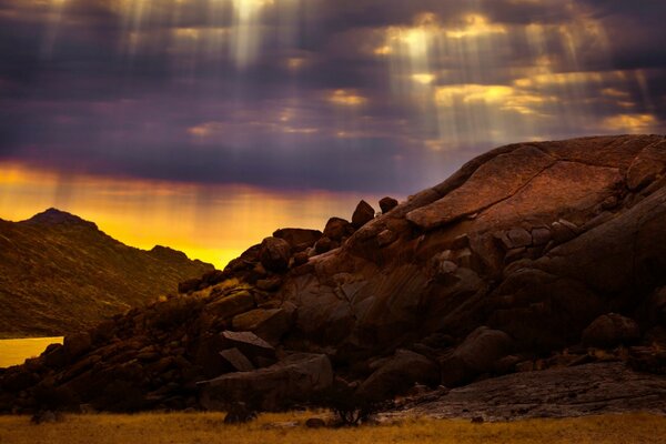 Mountains against the sunset sky