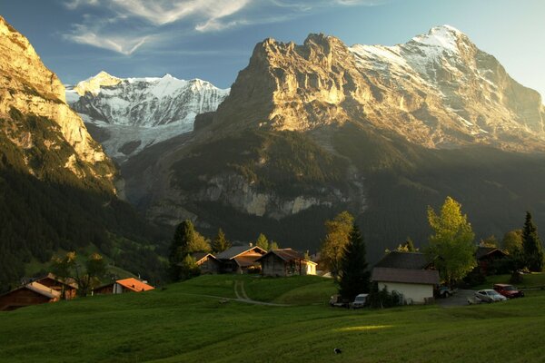 Snow in the mountains. And the greenery below