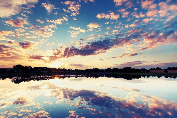 Beautiful sunset on the background of water