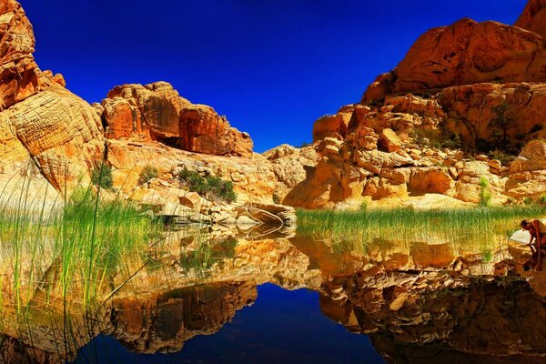 Mountain rocks in the reflection of the lake