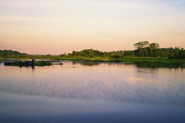 River landscape. Reflection of the sky in the water