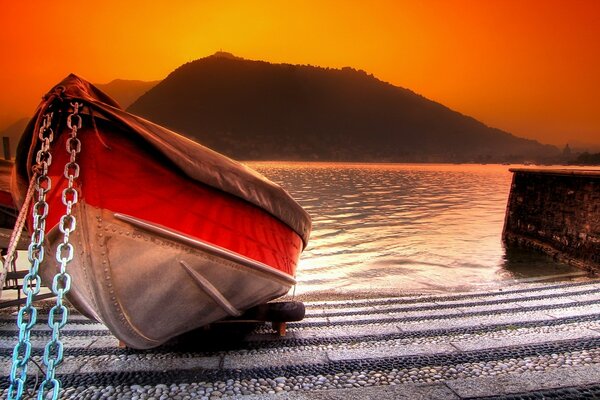 The pier of the river in the rays of sunset