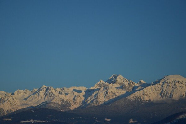 Snowy peaks of high mountains