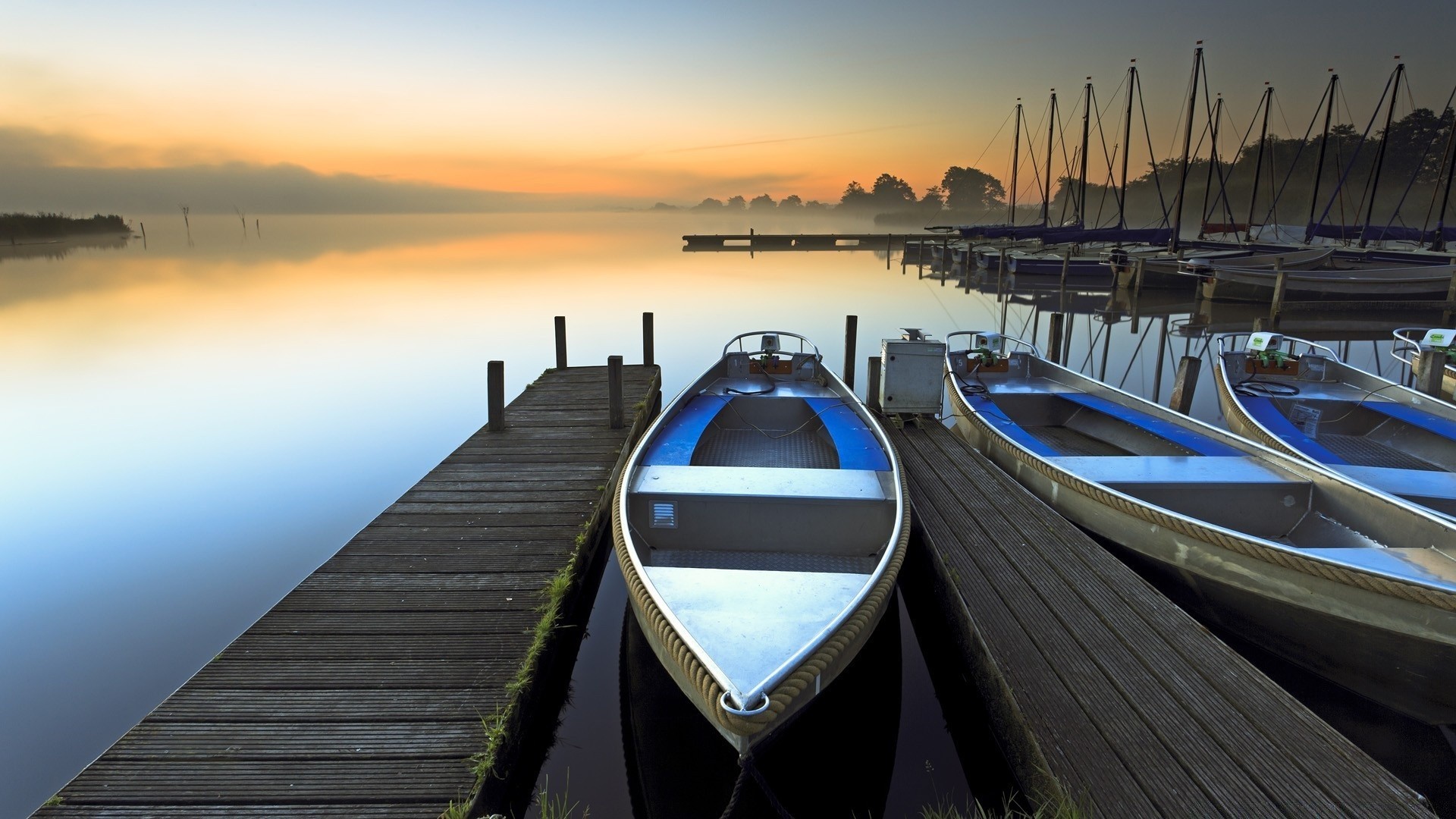 rivers ponds and streams water boat pier travel sea transportation system watercraft sunset reflection river harbor ocean ship sky lake jetty dawn bridge vehicle