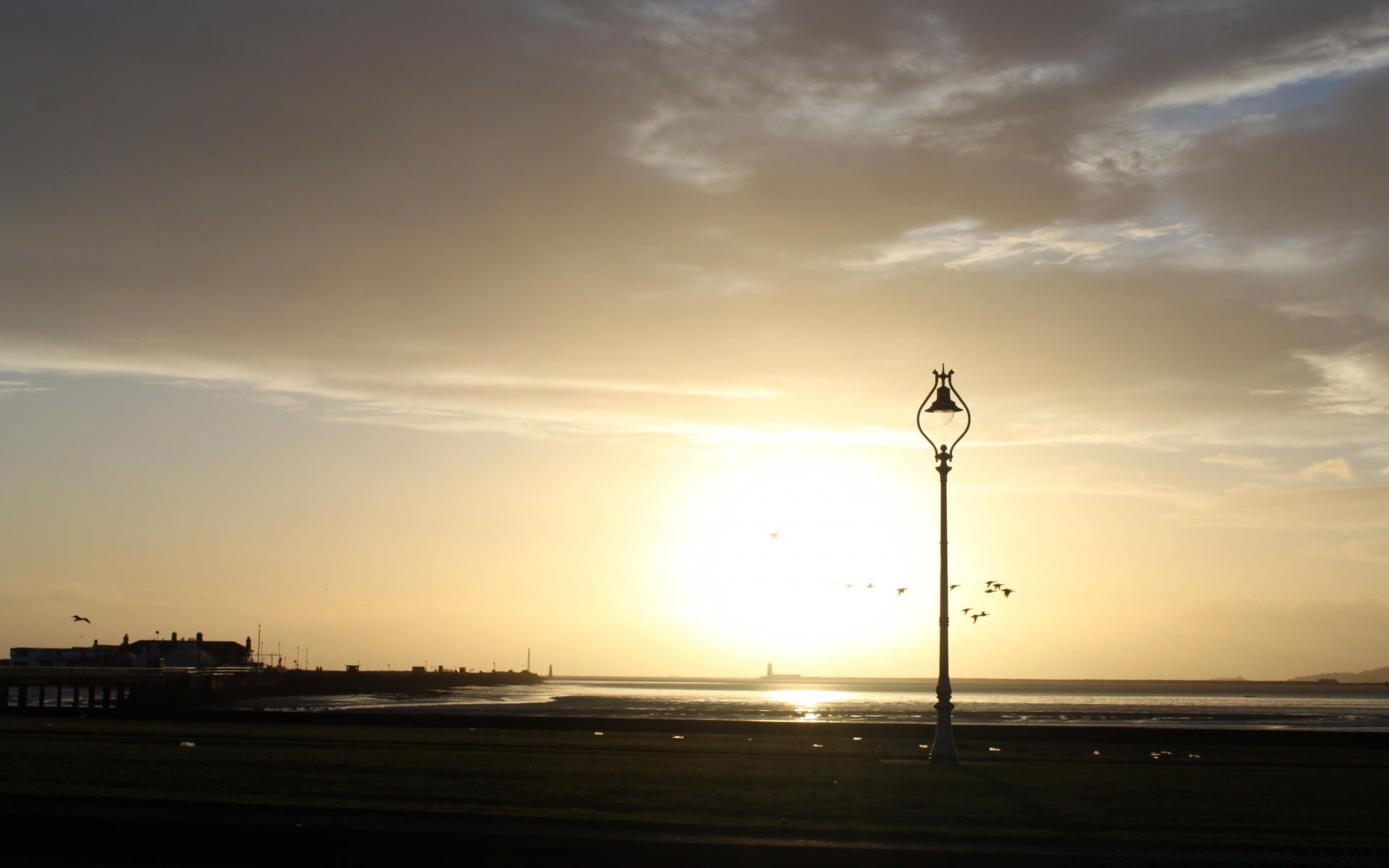 the sky sunset sky dawn sun landscape silhouette light evening dusk water sea beach backlit city travel ocean