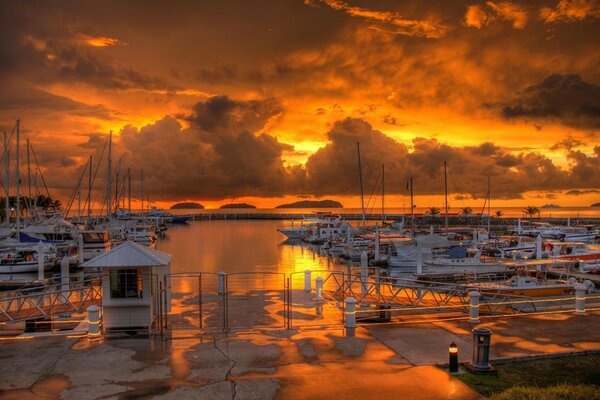 Sunset is reflected from the water at the sea in the port