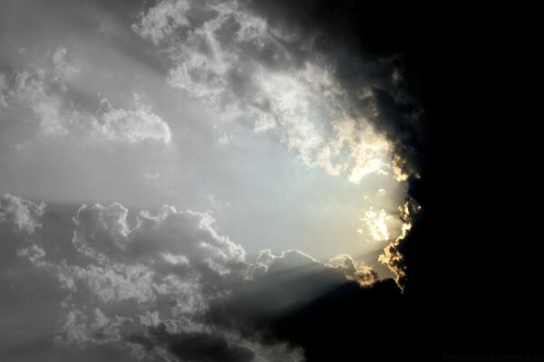 The light of the sun passes through dense clouds