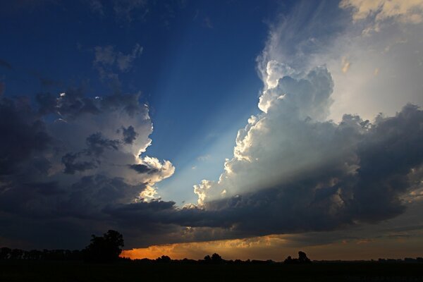 The horizon line is illuminated by the sun at sunset