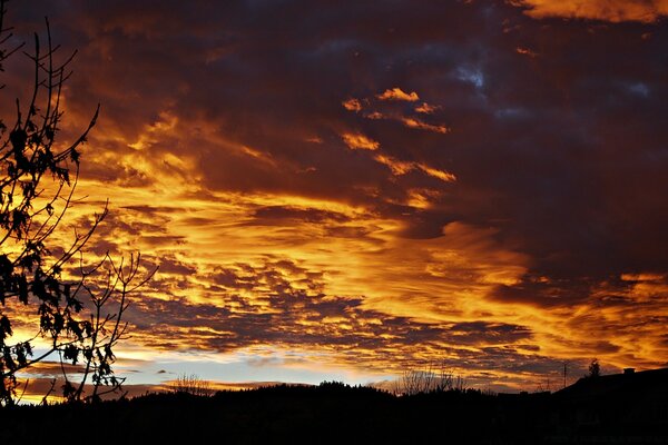 Sunset through clouds in the evening sky