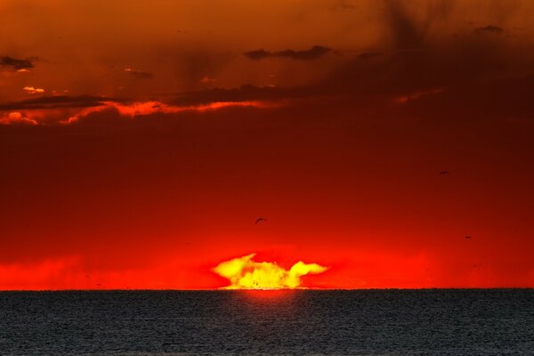 The sun going into a red sunset