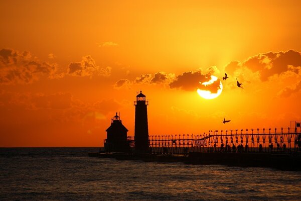 Beautiful evening sunset near the water and lighthouses