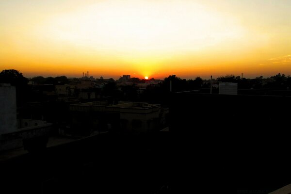 Sunset in the distance on the outskirts of the village