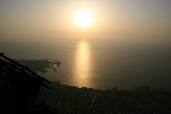 Sunset is reflected in the water on the island