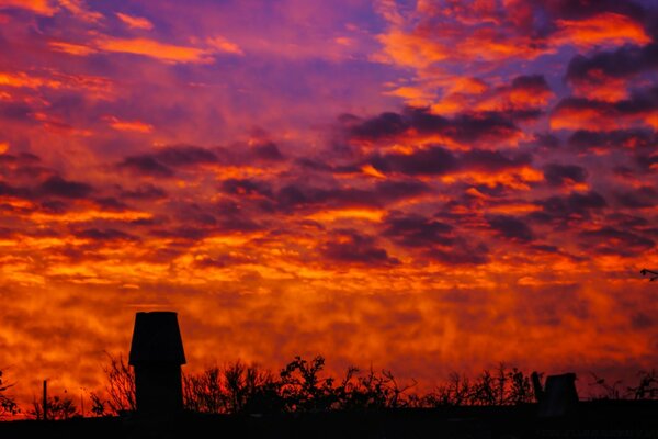 Fiery dawn in the blue sky