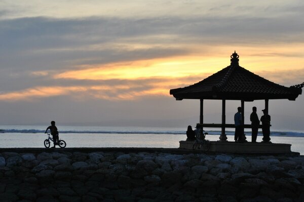 People on the beach by the ocean. Sky