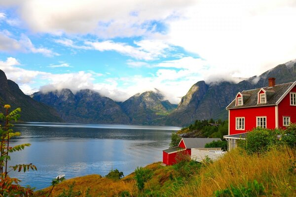 Red house on the lake shore