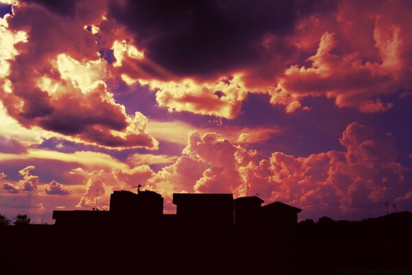 Sky clouds silhouettes of houses beauty