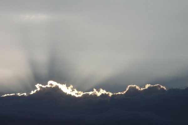 The rays of the sun piercing the clouds