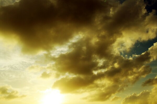 Storm clouds on the background of the sun