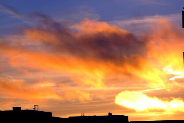 Sunset on the background of panel houses