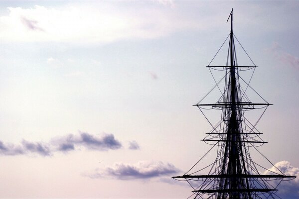 A ship on the background of the sky and the sea