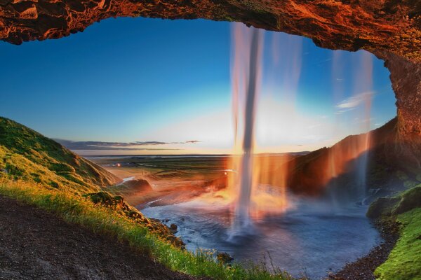 On a journey. Beautiful meadow and waterfall