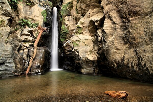 Image of a beautiful waterfall falling off a cliff