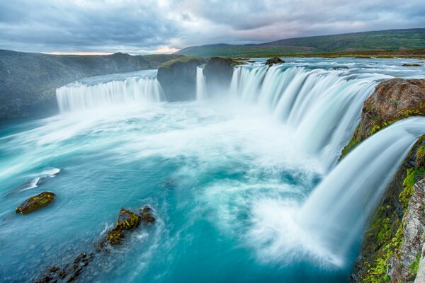 The picturesque landscape of the waterfall on a trip in nature