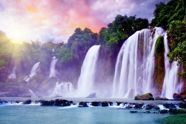 An extraordinary waterfall on the background of dawn